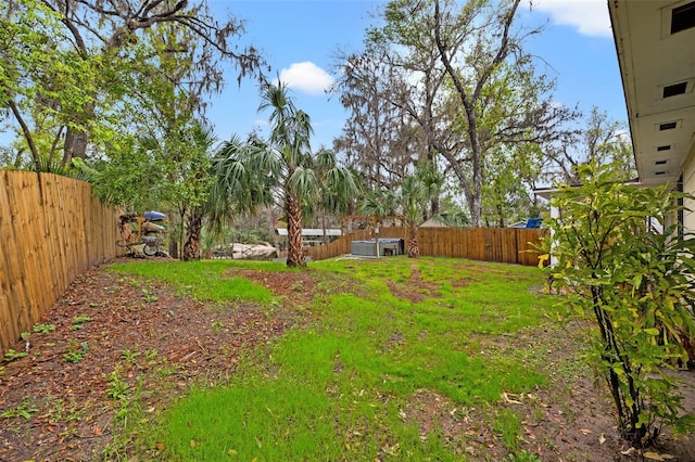 view of yard with a fenced backyard