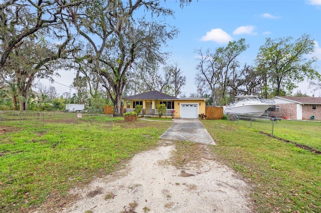 single story home featuring covered porch, a garage, fence, dirt driveway, and a front yard