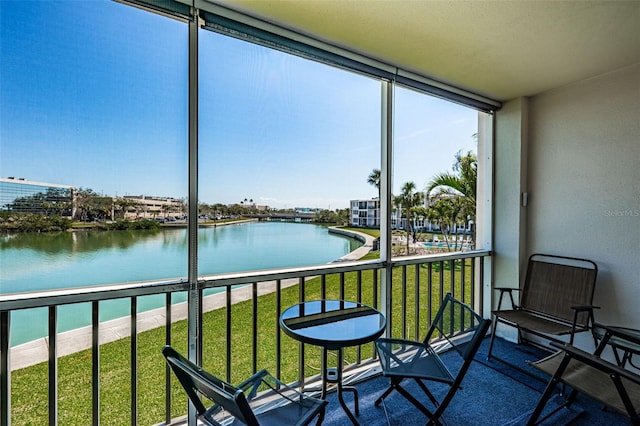 sunroom with a water view