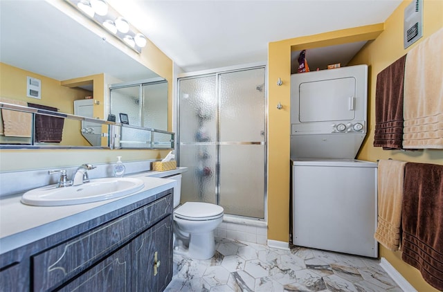 full bath featuring visible vents, vanity, marble finish floor, a shower stall, and stacked washer and clothes dryer