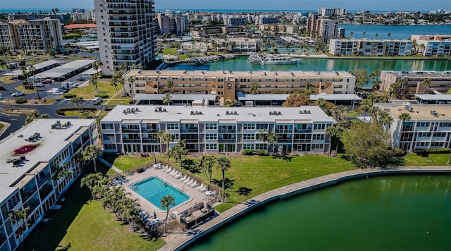 birds eye view of property featuring a water view and a city view