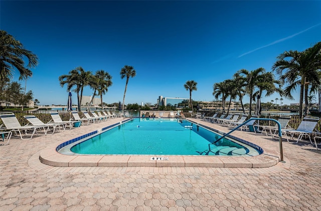 community pool with a patio area