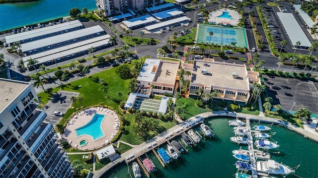 birds eye view of property with a water view