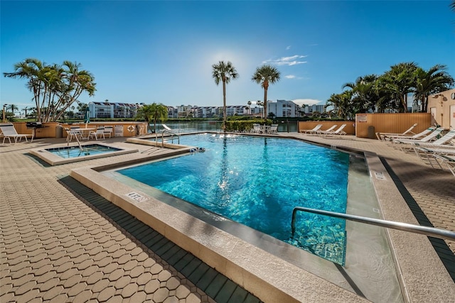 pool featuring a patio area and a hot tub