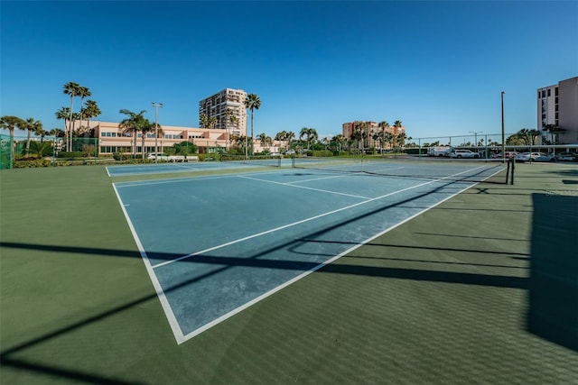 view of sport court with fence