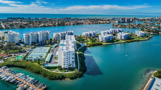 birds eye view of property featuring a water view and a city view