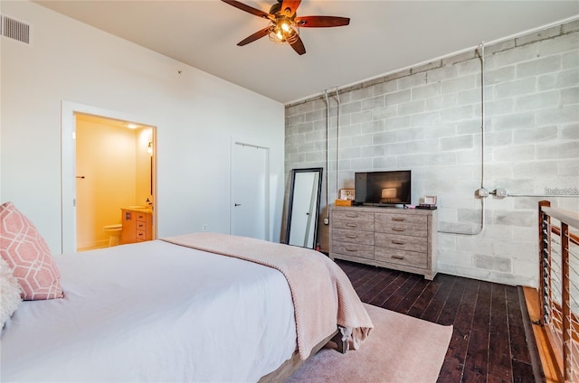 bedroom with a ceiling fan, visible vents, dark wood-type flooring, and ensuite bathroom