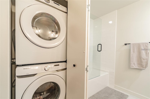 laundry area with laundry area and stacked washer / drying machine