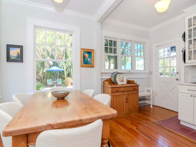 dining room featuring crown molding and wood finished floors