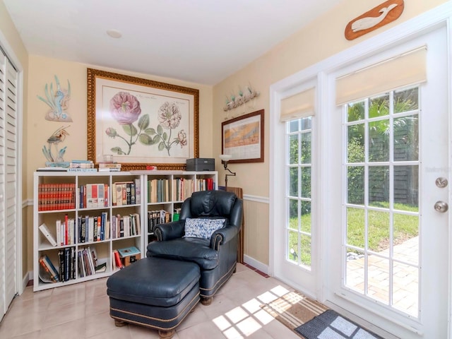 sitting room featuring tile patterned flooring