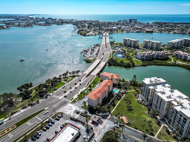 drone / aerial view with a city view and a water view