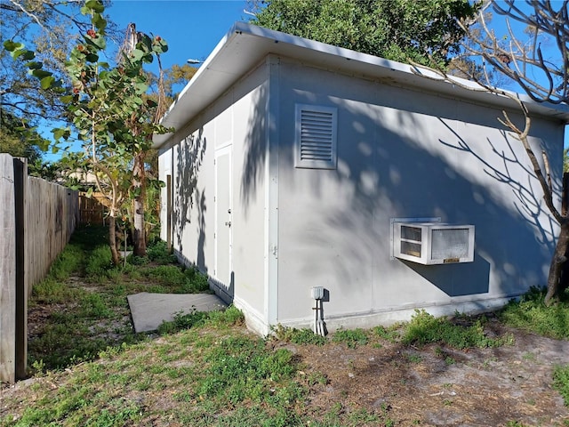 view of side of property with fence