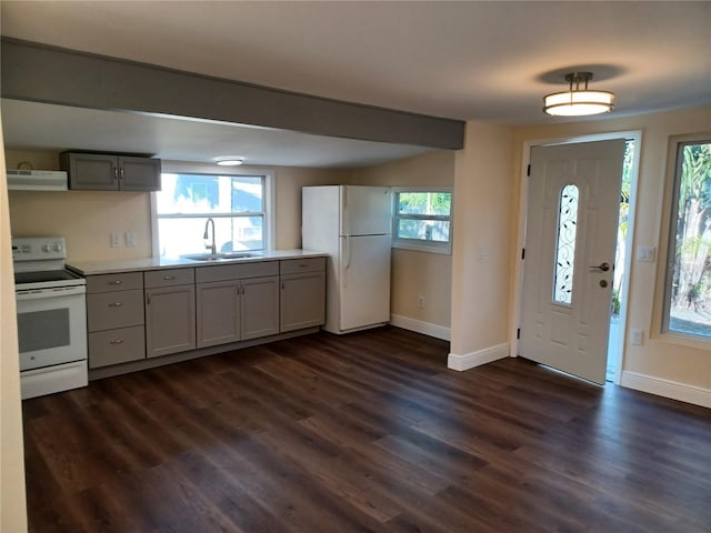 entryway featuring dark wood-style flooring and baseboards