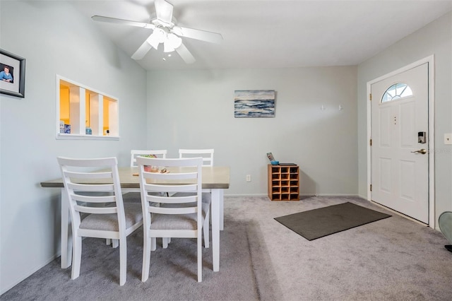 dining space featuring carpet, a ceiling fan, and baseboards