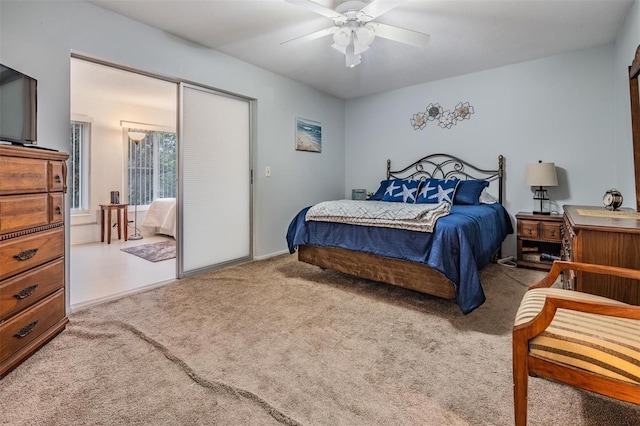 carpeted bedroom featuring a ceiling fan