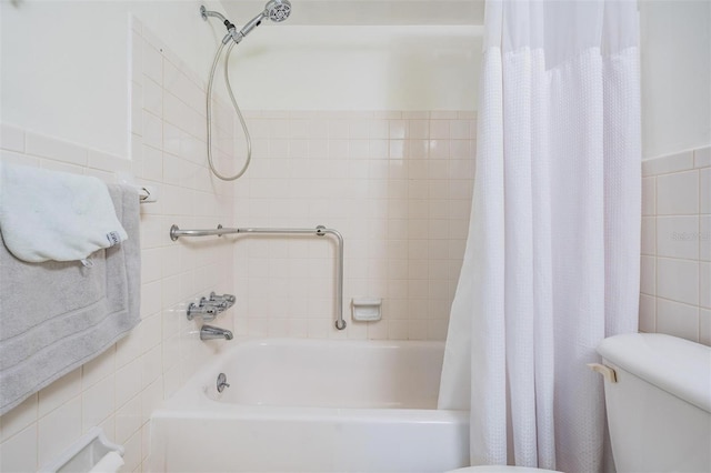 bathroom featuring shower / tub combo with curtain, tile walls, and toilet