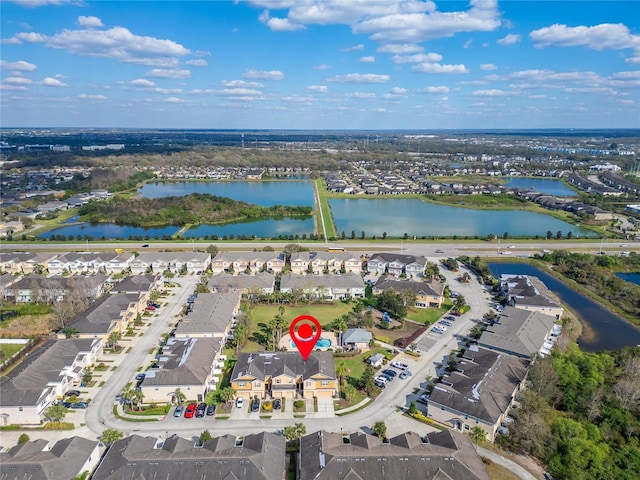 drone / aerial view featuring a water view and a residential view