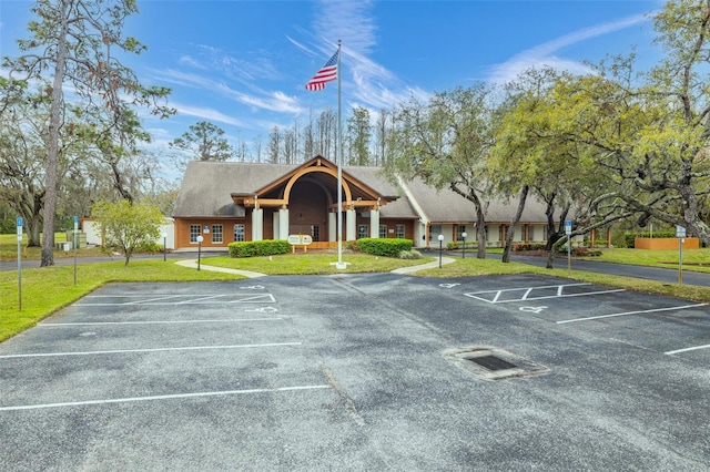 view of property with uncovered parking