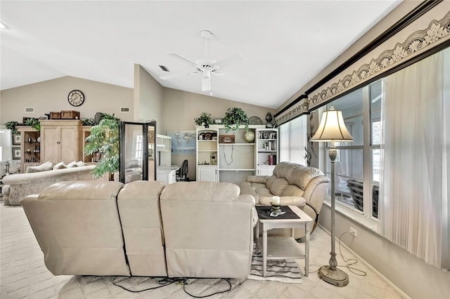 living room with a ceiling fan, visible vents, vaulted ceiling, and baseboards