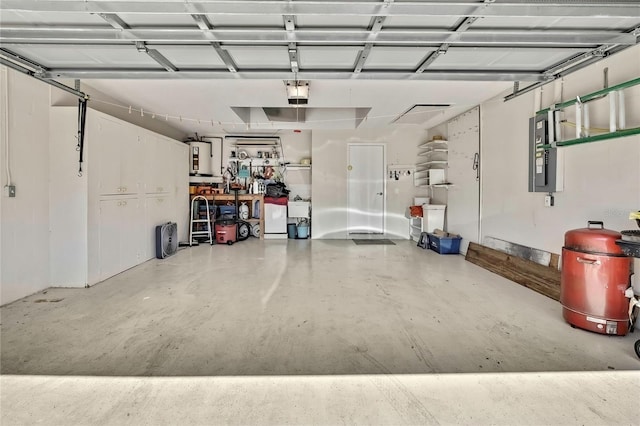 garage with electric panel and a garage door opener