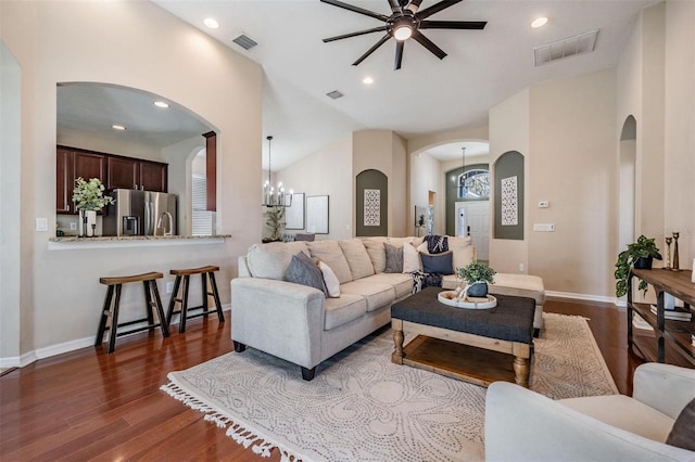 living area with recessed lighting, dark wood-style flooring, and visible vents