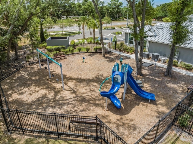 communal playground featuring cooling unit and fence