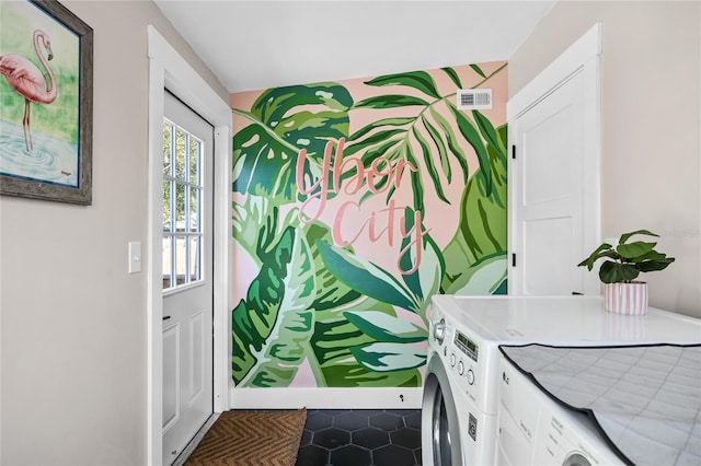 doorway to outside featuring separate washer and dryer and visible vents