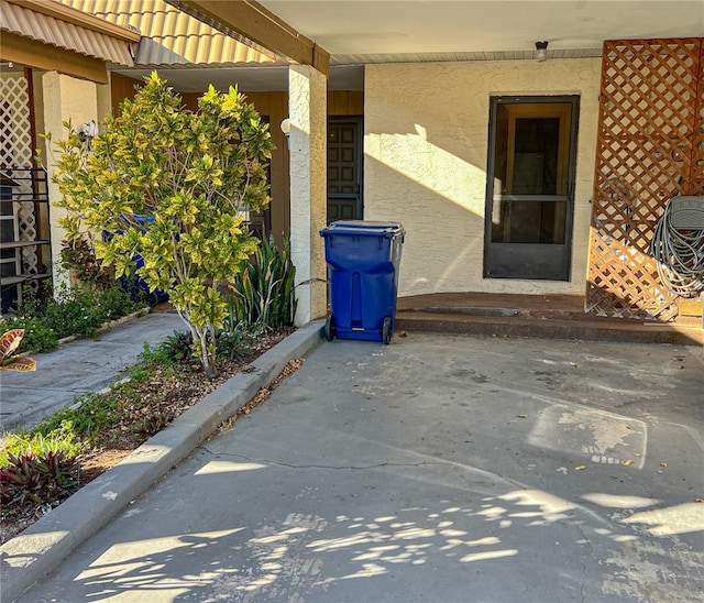 exterior space featuring stucco siding