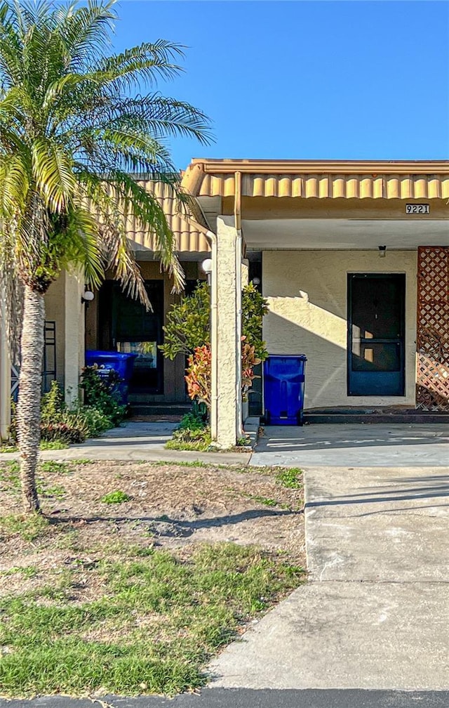 doorway to property with stucco siding