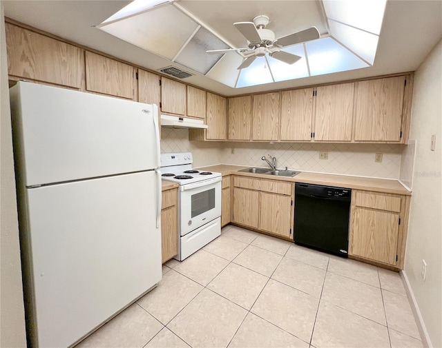 kitchen with light countertops, light brown cabinets, a sink, white appliances, and under cabinet range hood