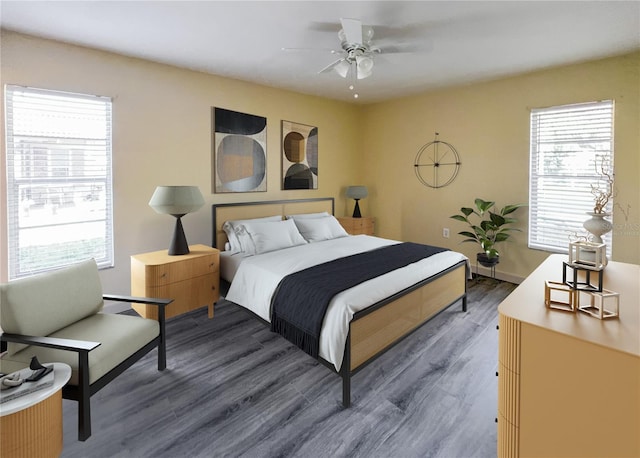 bedroom with a ceiling fan, baseboards, and dark wood-type flooring