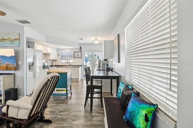 interior space featuring visible vents and wood finished floors