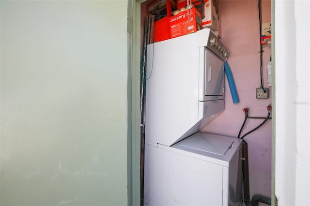 washroom with laundry area and stacked washer and clothes dryer