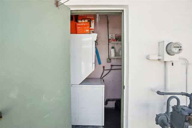 laundry area with laundry area and stacked washer and dryer