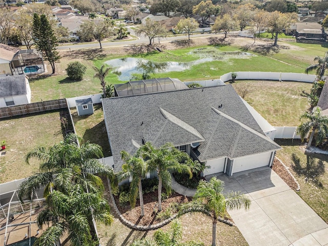 bird's eye view featuring a water view and a residential view