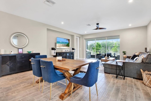 dining area with wood tiled floor, visible vents, ceiling fan, and recessed lighting