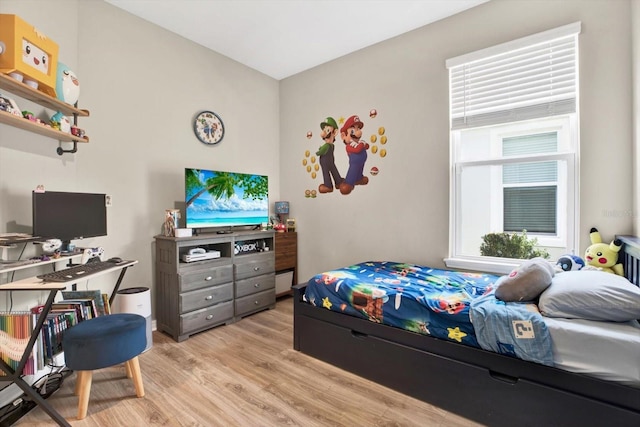 bedroom featuring light wood-style flooring