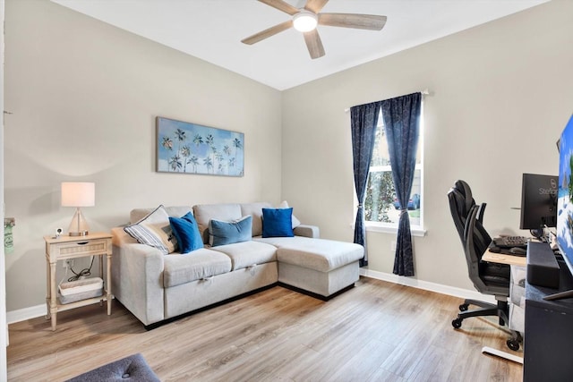 office with a ceiling fan, baseboards, and wood finished floors