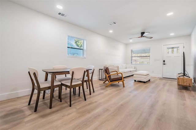 dining room featuring a wealth of natural light, light wood-type flooring, and visible vents