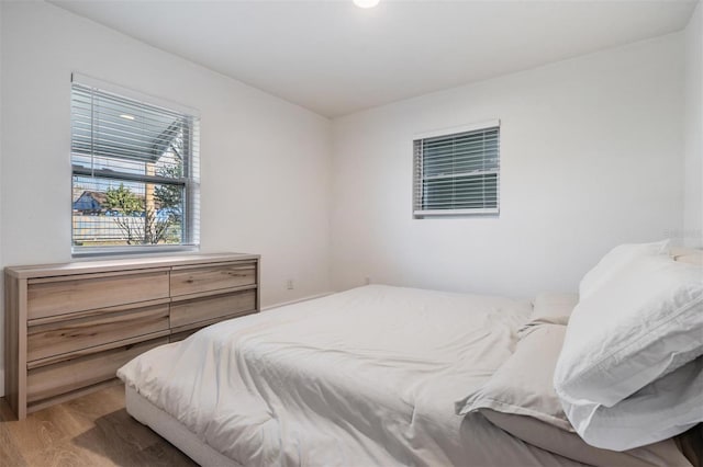 bedroom featuring wood finished floors