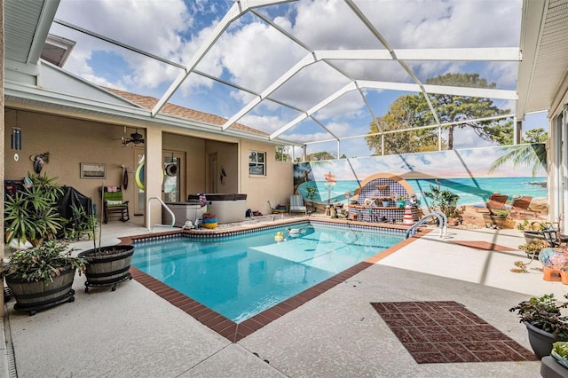 pool with glass enclosure and a patio area