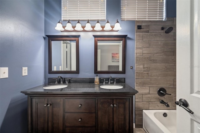 bathroom with double vanity, a sink, and shower / tub combination