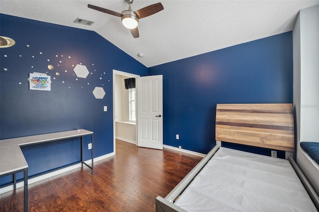 bedroom with dark wood-style floors, visible vents, vaulted ceiling, ceiling fan, and baseboards