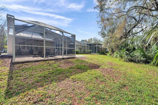 view of yard featuring a lanai and a patio