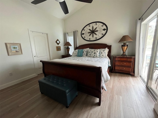 bedroom featuring high vaulted ceiling, ceiling fan, baseboards, and wood finished floors