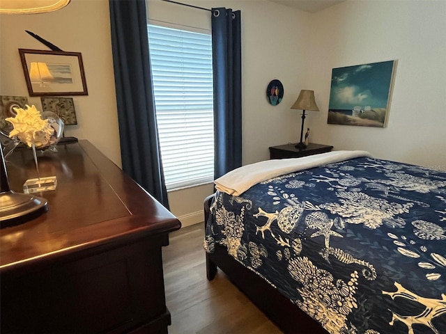 bedroom featuring wood finished floors