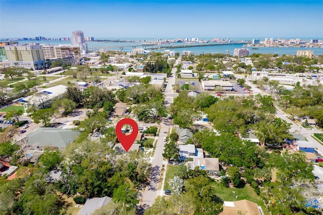 birds eye view of property with a city view and a water view