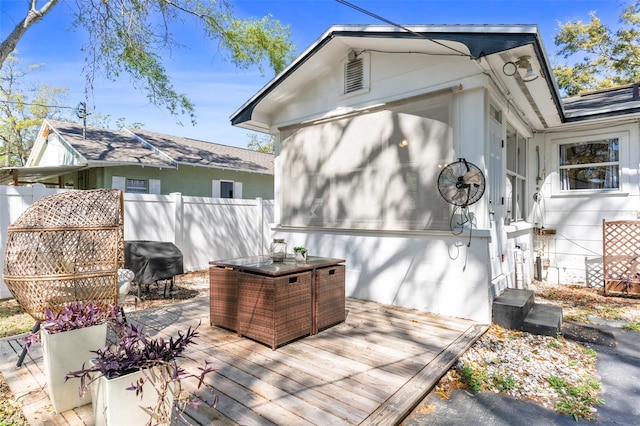 wooden deck with fence and grilling area