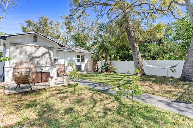 view of yard with a patio and fence