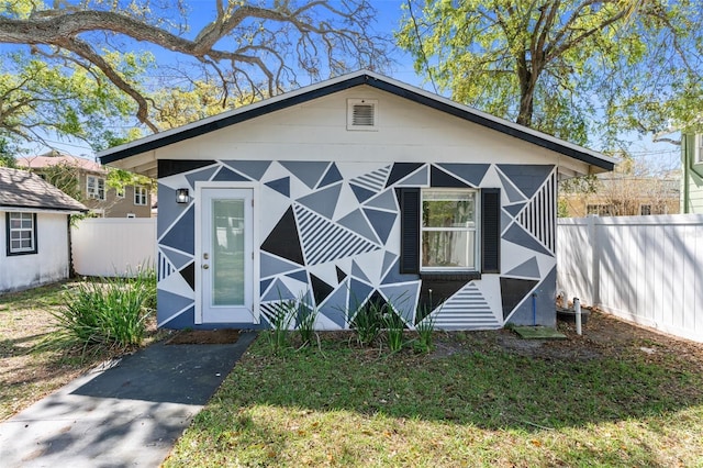 view of outdoor structure with fence